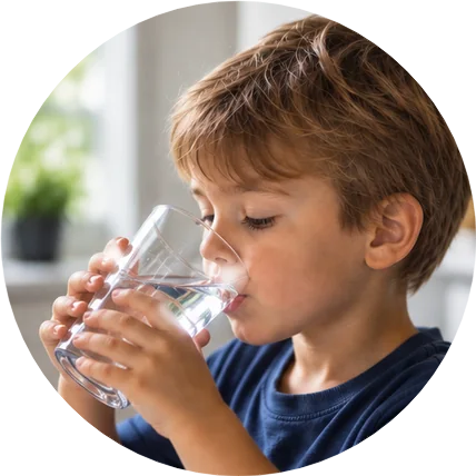 Boy drinking a glass of water